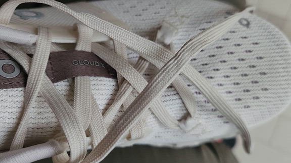 Shoe lace is dirty and shoe sole has marks
