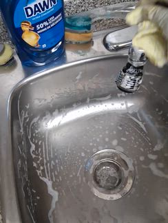 Cleaning the sink.
